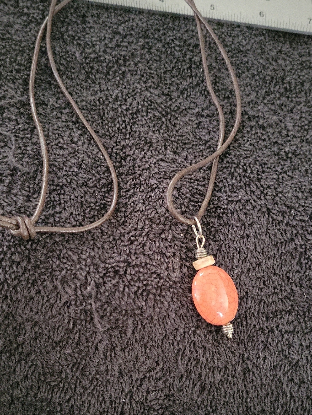 Source Unknown Orange Stone Pendant on Brown Cord Necklace